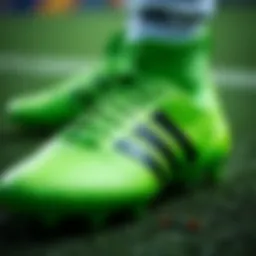 Close-up view of Adidas green cleats showcasing intricate design details