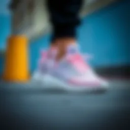 Elegantly designed Adidas Tensaur Run sneakers showcasing their sleek silhouette.