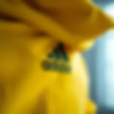 Close-up of the Adidas yellow sweatshirt showcasing its fabric texture