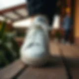 Stylish canvas shoes on a wooden surface