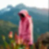 Chic North Face pink jacket on a scenic mountain backdrop