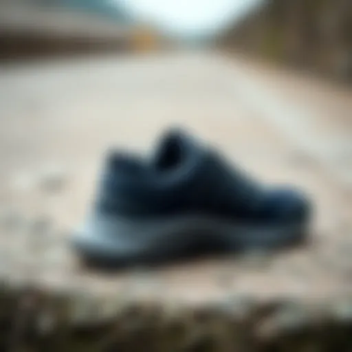 A close-up of a stylish outdoor shoe on a textured surface, showcasing its design.