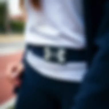 Stylish Integration of Under Armour Belt in Sportswear Stylish Under Armour belt paired with fashionable sportswear